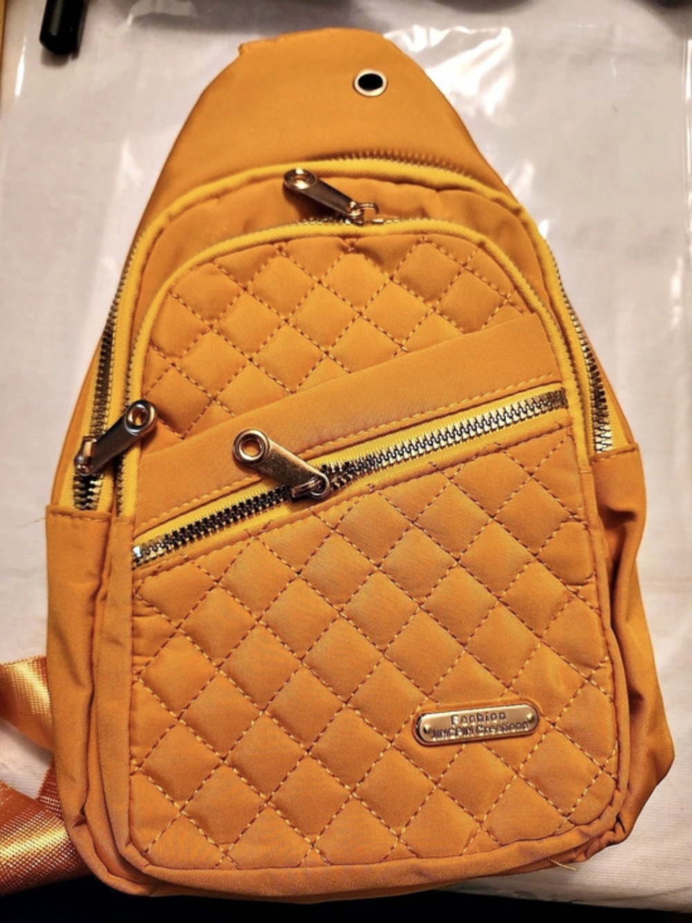 Baggallini Quilted Sling Backpack in Orange